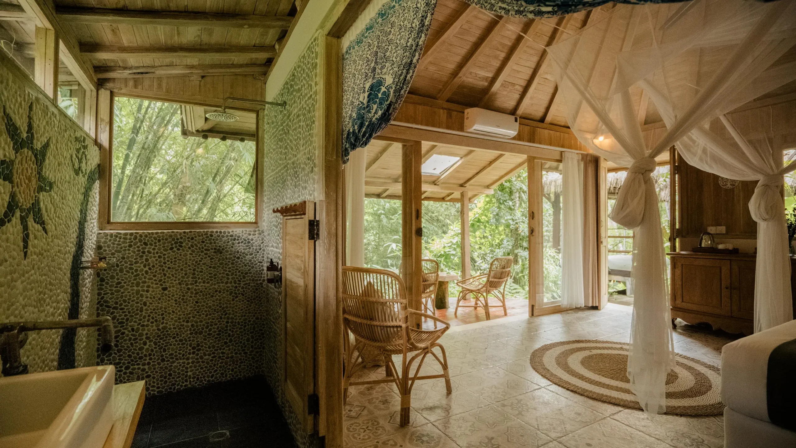 Cozy retreat venue room featuring a bed and chair, ideal for partnership collaboration sessions.