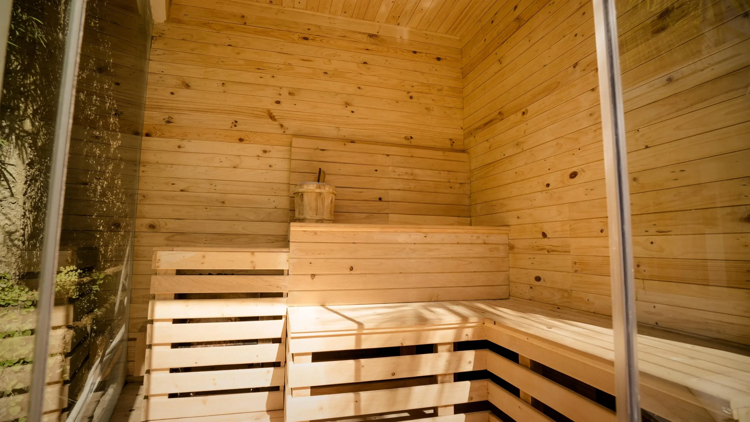 Sauna with wooden walls, bench; ideal facilities for your retreat.