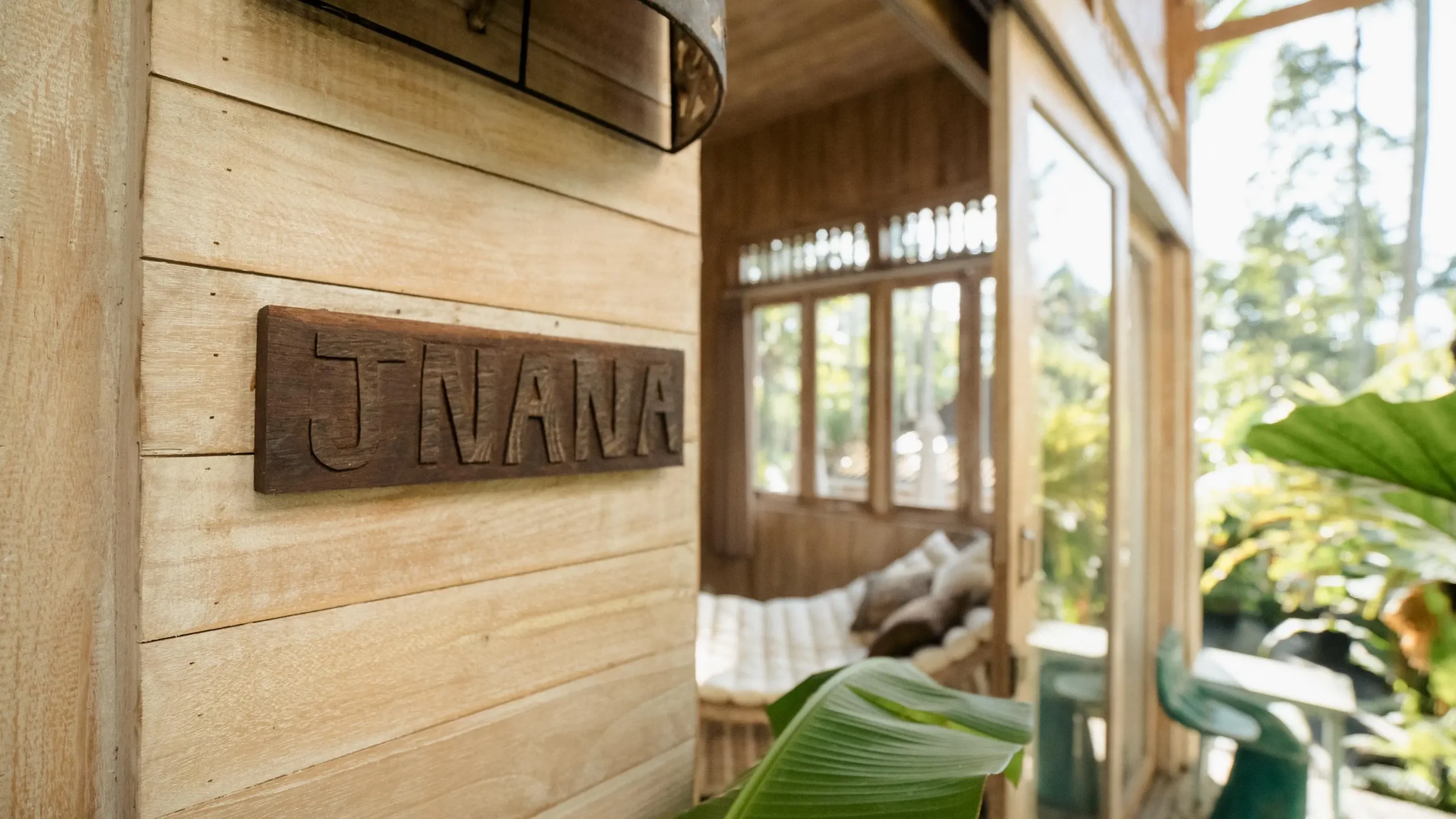 rustic wooden wall with 'Jam' sign at wellness retreat for couples