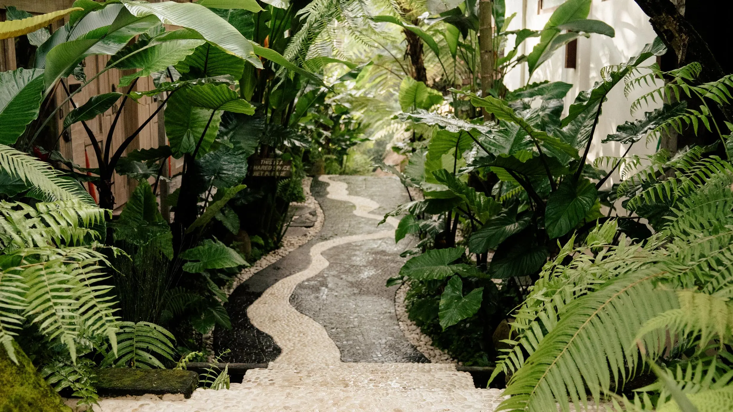 Heart-shaped tile on a pathway, symbolizing how to host a retreat with care and intention