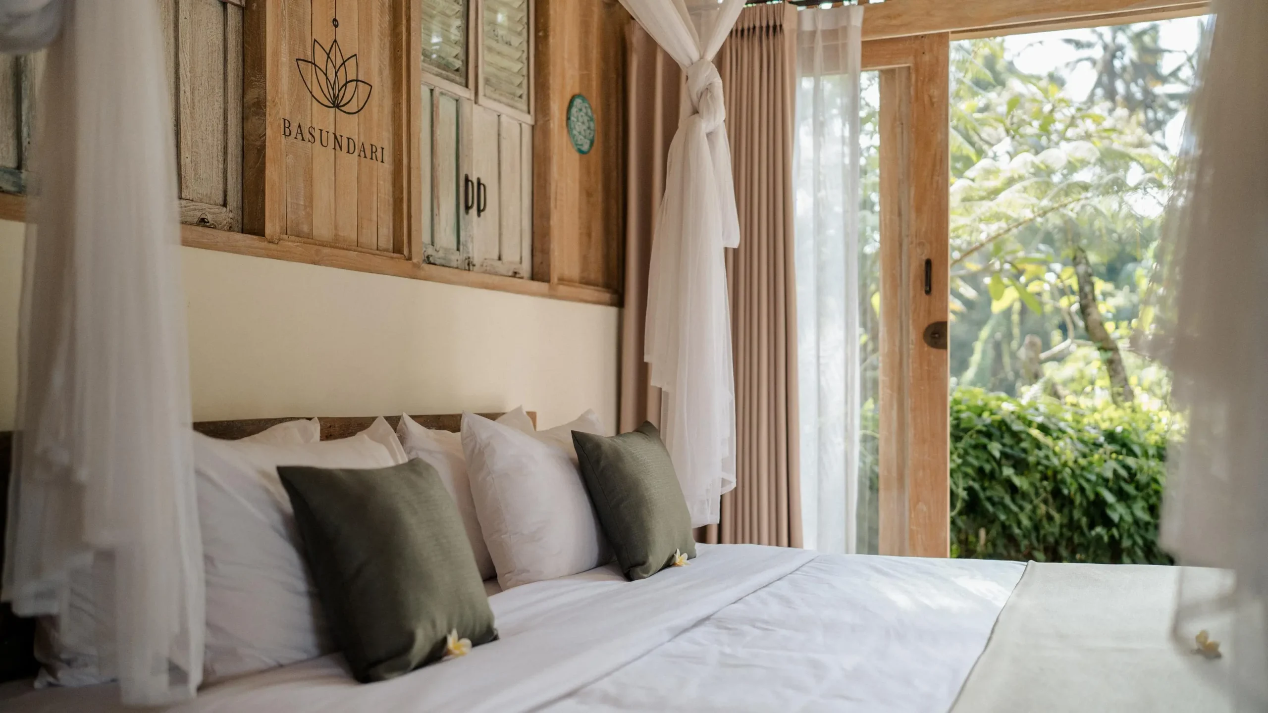 Luxurious bed with canopy in serene setting, illustrating a retreat business model ambiance