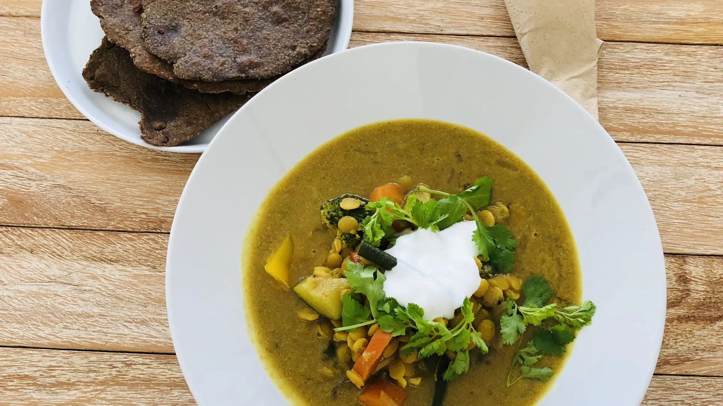 retreat vs vacation concept: serene nature retreat contrasted with busy beach vacation scene