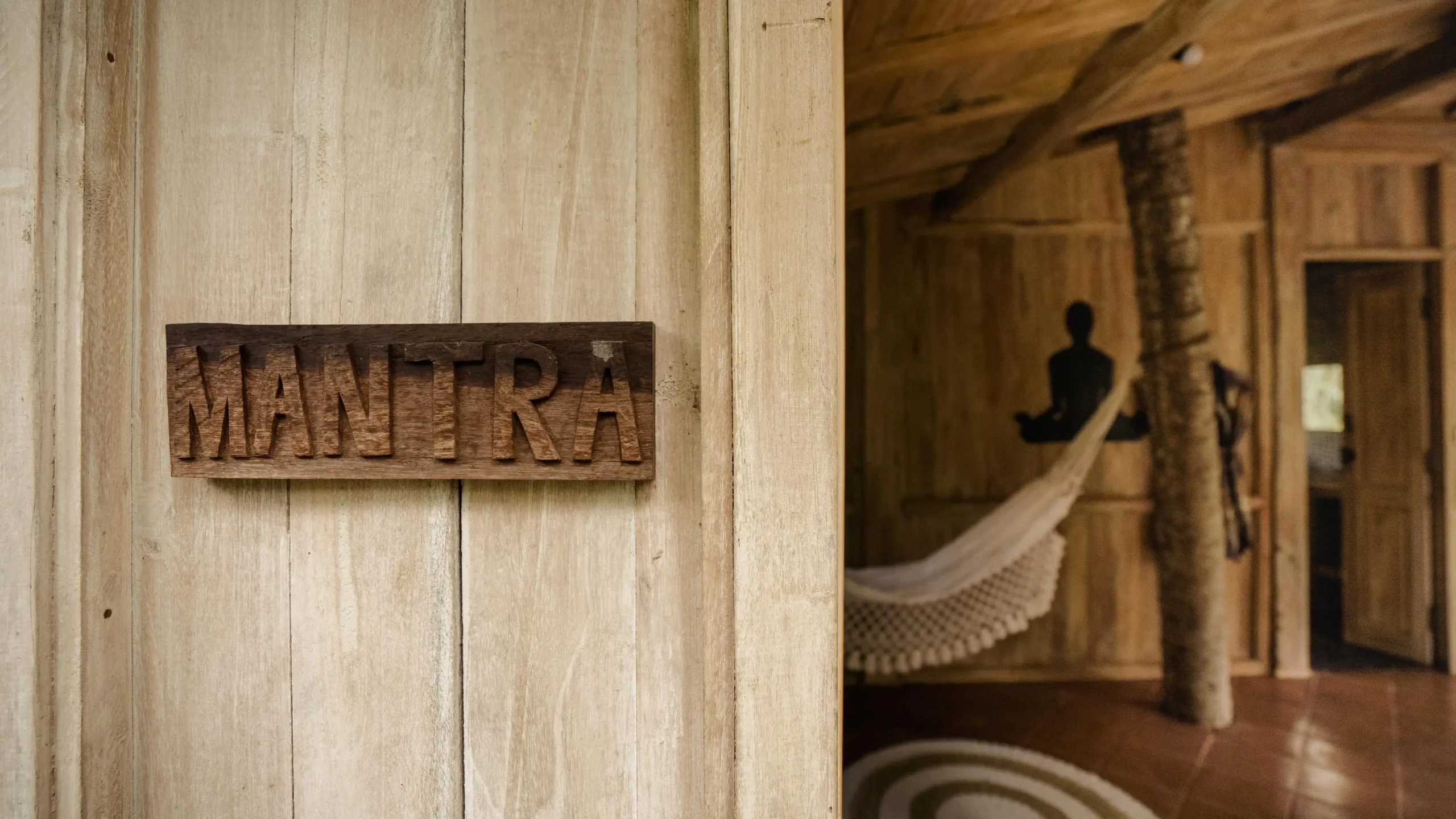 rustic wooden door with “ham” sign in a cafe near waterfalls near Ubud