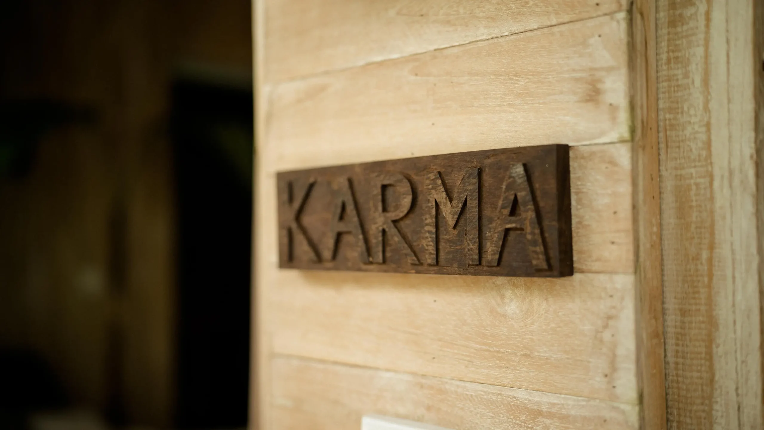 Yoga for weight loss home practice: wooden studio door with metal nameplate