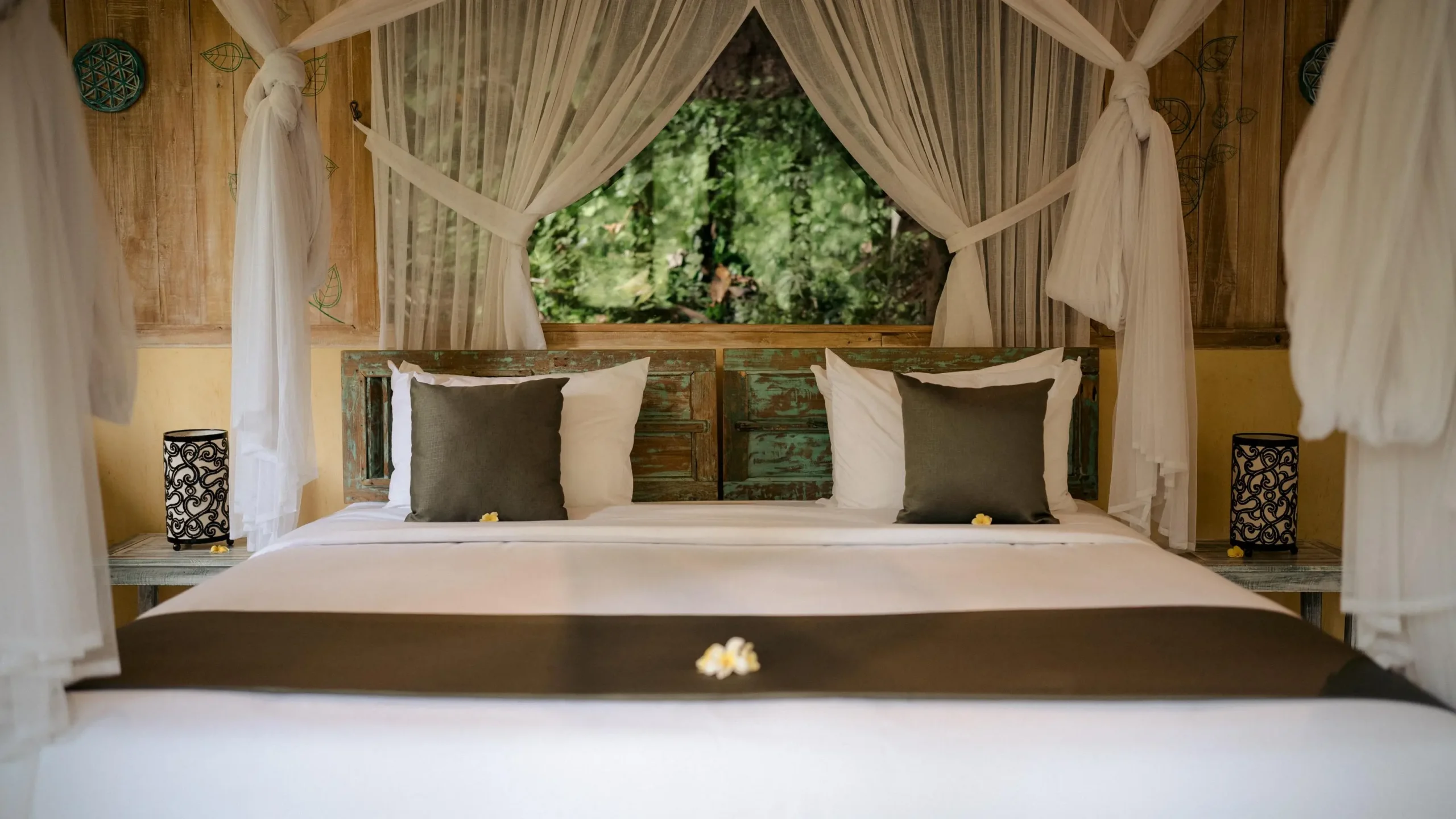 Cozy canopy bed in a peaceful setting featured in a retreat planner guide