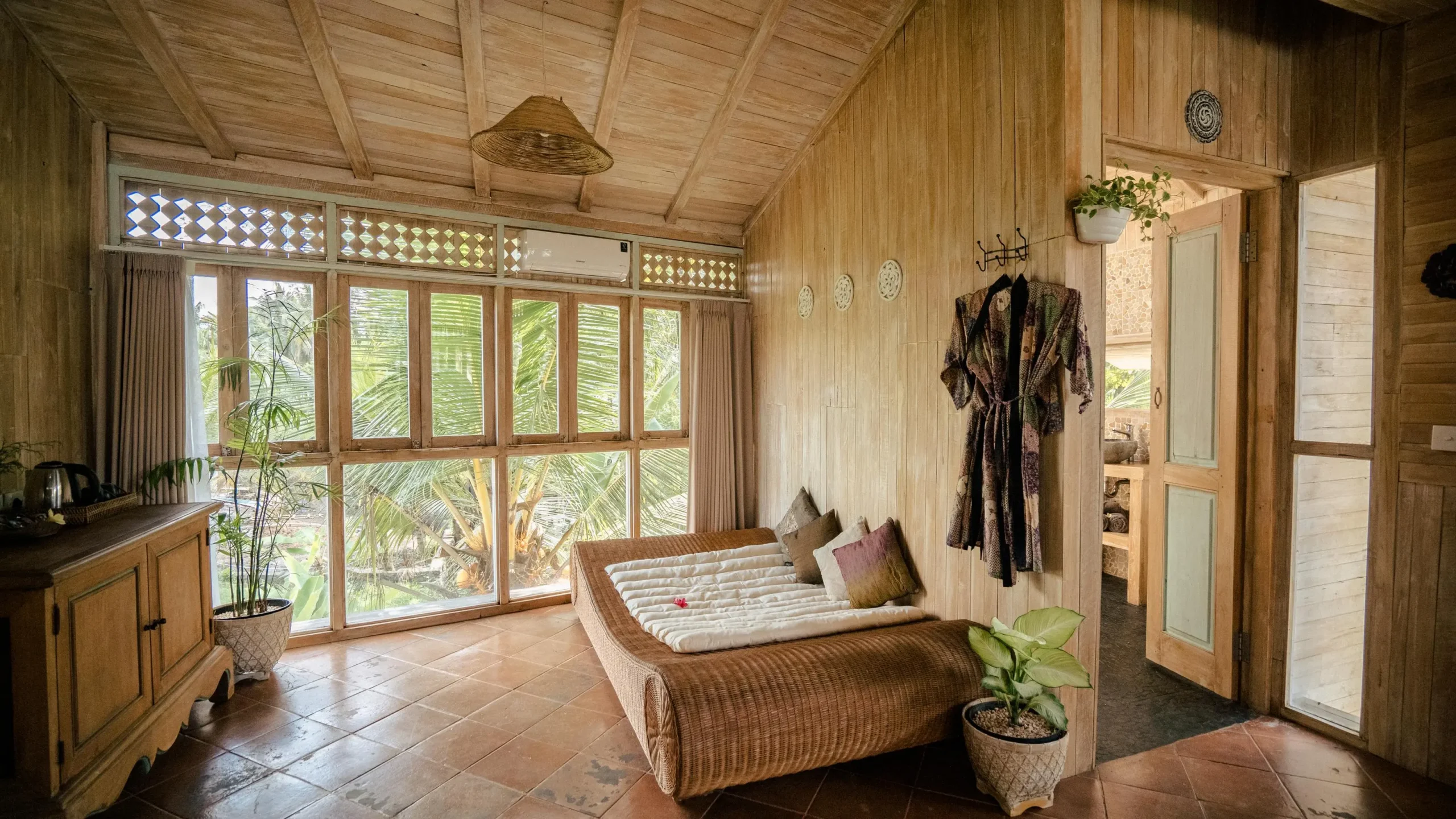 Bedroom showcasing Basundari organizer case studies with neatly arranged bed and window view